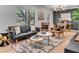 Chic living room featuring a leather sofa, stylish armchairs, and modern decor at 5155 Monterey St, North Charleston, SC 29405