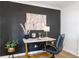 Chic office space with a desk, a dark accent wall, decor and a comfortable black chair at 5155 Monterey St, North Charleston, SC 29405