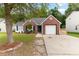 Charming brick home with attached garage and well-manicured lawn at 5332 Copley Cir, Summerville, SC 29485