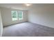 Inviting bedroom with plush carpeting, abundant natural light, and scenic outdoor views at 538 Pender Woods Dr, Summerville, SC 29486