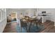 Inviting dining area adjacent to a modern kitchen and sunlit living room, perfect for gatherings at 542 Pender Woods Dr, Summerville, SC 29486