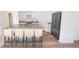 Spacious kitchen island with granite countertops, seating, and stainless steel refrigerator at 542 Pender Woods Dr, Summerville, SC 29486