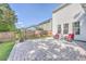 Spacious backyard with a stone patio, lush green grass, and mature landscaping, ideal for outdoor living at 612 S Pointe Blvd, Summerville, SC 29483