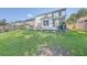 Green backyard with a stone patio, a well-kept lawn, and fencing, great for relaxation and outdoor activities at 612 S Pointe Blvd, Summerville, SC 29483