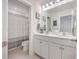 Bright bathroom featuring a double sink vanity, framed mirrors, and a shower-tub combination at 612 S Pointe Blvd, Summerville, SC 29483