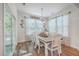 Bright dining room with a rustic wood table, seating for six, and natural light from windows at 612 S Pointe Blvd, Summerville, SC 29483