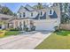 Charming two-story white home with a well-maintained lawn and spacious driveway at 612 S Pointe Blvd, Summerville, SC 29483
