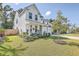 Charming home with a well-manicured lawn and front porch seating, enhancing curb appeal at 612 S Pointe Blvd, Summerville, SC 29483