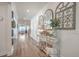 Hallway with a decorative console table and hardwood flooring at 612 S Pointe Blvd, Summerville, SC 29483