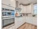 Modern kitchen featuring stainless steel appliances, light cabinets, and tiled backsplash at 612 S Pointe Blvd, Summerville, SC 29483