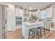 Open concept kitchen with white cabinets, granite countertops, stainless steel appliances, and pendant lighting at 612 S Pointe Blvd, Summerville, SC 29483