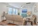 Cozy living room with hardwood floors and large windows that provide abundant natural light at 612 S Pointe Blvd, Summerville, SC 29483