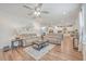 Open-concept living room with hardwood floors, seating and views to kitchen at 612 S Pointe Blvd, Summerville, SC 29483