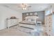 Bright and spacious main bedroom with a large bed, stylish decor, accent wall, and neutral colored carpet at 612 S Pointe Blvd, Summerville, SC 29483