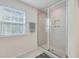 Modern shower featuring glass doors, neutral tiling, a built in shelf, and plenty of natural light at 612 S Pointe Blvd, Summerville, SC 29483