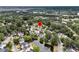 Picturesque neighborhood with lush greenery, serene pond, and well-maintained homes, ideal for peaceful living at 613 Antebellum Ln, Mount Pleasant, SC 29464