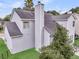 A view of the back of the house showcasing the chimney and the home's neutral siding at 613 Antebellum Ln, Mount Pleasant, SC 29464