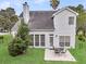 A view of the back of the house showcasing the patio and the home's neutral siding at 613 Antebellum Ln, Mount Pleasant, SC 29464