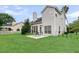 The backyard features a patio with a table and chairs, perfect for outdoor relaxation at 613 Antebellum Ln, Mount Pleasant, SC 29464