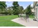 A view of the backyard featuring a patio with outdoor seating and grassy area at 613 Antebellum Ln, Mount Pleasant, SC 29464