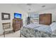 Well-lit bedroom with a window, black bed frame and tv at 613 Antebellum Ln, Mount Pleasant, SC 29464