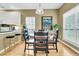 Dining area with natural light and kitchen view, perfect for Gathering meals at 613 Antebellum Ln, Mount Pleasant, SC 29464