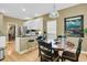 Cozy dining area adjacent to the kitchen with a round table and decorative painting at 613 Antebellum Ln, Mount Pleasant, SC 29464