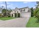 Well-maintained two-story home with manicured bushes and an attached garage, showcasing suburban charm at 613 Antebellum Ln, Mount Pleasant, SC 29464