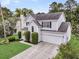 Beautiful two-story home with a spacious driveway and manicured lawn, nestled in a lovely neighborhood at 613 Antebellum Ln, Mount Pleasant, SC 29464