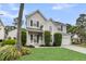 Charming two-story home with a well-kept lawn and elegant landscaping, inviting and picturesque at 613 Antebellum Ln, Mount Pleasant, SC 29464