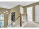 Hallway leading to a bright bathroom with white fixtures at 613 Antebellum Ln, Mount Pleasant, SC 29464
