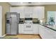 Bright kitchen with white cabinetry, stainless steel refrigerator, and modern appliances at 613 Antebellum Ln, Mount Pleasant, SC 29464