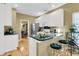 Open-concept kitchen featuring a breakfast bar with seating and stainless steel appliances at 613 Antebellum Ln, Mount Pleasant, SC 29464