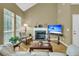Bright living room featuring a fireplace with marble hearth, and natural light from large windows at 613 Antebellum Ln, Mount Pleasant, SC 29464