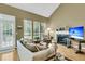 Inviting living room with large windows, fireplace, and neutral decor at 613 Antebellum Ln, Mount Pleasant, SC 29464