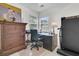 Functional home office space with desk, treadmill, dresser, and natural light at 613 Antebellum Ln, Mount Pleasant, SC 29464