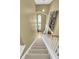 Carpeted staircase with white railing leading to the upper level at 613 Antebellum Ln, Mount Pleasant, SC 29464