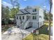 Stunning coastal home with elevated living, showcasing a two-car garage and inviting stairway at 6518 Beagle Club Rd, Meggett, SC 29449