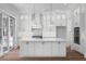 Beautiful all-white kitchen with a large center island and modern appliances at 6518 Beagle Club Rd, Meggett, SC 29449