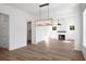 Inviting living room with wood floors, and a cozy fireplace at 6518 Beagle Club Rd, Meggett, SC 29449