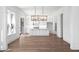Spacious open-concept kitchen and dining area featuring hardwood floors and modern appliances at 6518 Beagle Club Rd, Meggett, SC 29449
