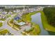 Aerial view of community pool, playground, pond and neighborhood at 658 Yellow Leaf Ln, Summerville, SC 29486