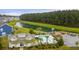 Community features a clubhouse, pool, playground, and a lake with a backdrop of mature trees at 658 Yellow Leaf Ln, Summerville, SC 29486