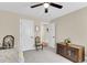 Well-lit bedroom featuring a ceiling fan, wooden cabinet, and neutral wall color at 658 Yellow Leaf Ln, Summerville, SC 29486