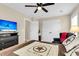 Comfortable bedroom featuring a ceiling fan, large TV, and a cozy decorative star-themed quilt at 658 Yellow Leaf Ln, Summerville, SC 29486