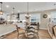 Eat-in kitchen next to stainless appliances and island with pendant lighting at 658 Yellow Leaf Ln, Summerville, SC 29486