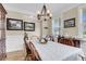 Bright dining room featuring hardwood floors, wainscoting, and chandelier at 658 Yellow Leaf Ln, Summerville, SC 29486