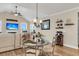 Bright dining area features a glass-top table, vaulted ceiling, and access to the living room at 658 Yellow Leaf Ln, Summerville, SC 29486