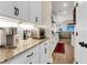 Well-lit kitchen featuring granite countertops, white cabinets, and stainless steel appliances at 658 Yellow Leaf Ln, Summerville, SC 29486