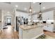 Kitchen island offering bar seating, granite counters, and stainless appliances at 658 Yellow Leaf Ln, Summerville, SC 29486